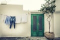 Italian vintage scene. Clothes hanging to dry and old house. Royalty Free Stock Photo