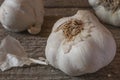 Italian white garlic bulbs on wooden table Royalty Free Stock Photo