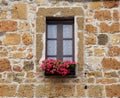 Italian window with nice flowers in old stone house, Tuscany, It Royalty Free Stock Photo