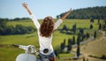 Italian woman sitting on a italian scooter Royalty Free Stock Photo