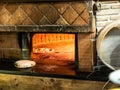 Italian wood oven lit, with pizzas