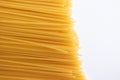 Italian yellow spaghetti isolated on white background, top view. Texture of pasta with selective focus viewed from above Royalty Free Stock Photo