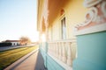 italianate belvedere shadow cast upon the side of the residence during sunrise