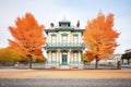 italianate house featuring a belvedere amid a backdrop of autumn leaves Royalty Free Stock Photo