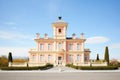italianate mansion with a prominent belvedere against a clear blue sky