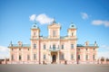 italianate mansion with a prominent belvedere against a clear blue sky