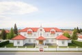 italianate residential estate with white belvedere and red roof