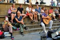 Italians enjoying a summer day in Florence , Italy with street artists and spectators