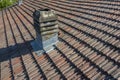 Italiy tile roof chimney detail drone view