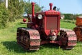 Italy. Antique tractor Bubba Ariete in a green field.