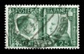 ITALY - 16 April 1941: Italian historical stamp: German-Italian brotherhood in arms, Portraits of Hitler and Mussolini with symbo