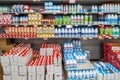 milk packed in plastic bottles and boxes food cartons of various types and brands arranged on shelves Royalty Free Stock Photo