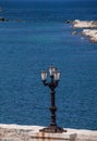 Italy. Bari. The Lungomare. View with a three-light lamppost facing the Adriatic Sea