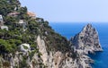 Italy. Capri Island. Faraglioni rock formation and town Capri Royalty Free Stock Photo