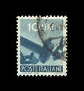 Cancelled postage stamp printed by Italy, that shows Hammer breaking chains, circa 1961.