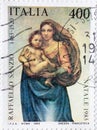 ITALY- CIRCA 1983: a postage stamp printed in the Italy showing the Sistine Madonna by Raffael on the Christmas Postal stamp 1983