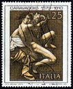 ITALY - CIRCA 1973: A stamp printed in Italy shows St. John the Baptist by Caravaggio, circa 1973. Royalty Free Stock Photo