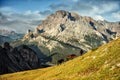 Italy, Dolomites - wonderful landscapes, horses graze near the barren rocks
