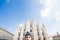 Italy, excursion and travel concept - funny guy taking selfie in front of cathedral Duomo in Milan Royalty Free Stock Photo