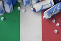 Italy flag and few used aerosol spray cans for graffiti painting. Street art culture concept
