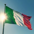 Italy flag on flagpole with blue and sky with sun background. Italian flag sunny day Royalty Free Stock Photo