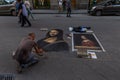 italy, florence 2018 - artist painting a copy of monalisa on a street in florence