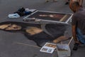 italy, florence 2018 - artist painting a copy of monalisa on a street in florence