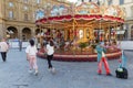 italy, florence - 2018 - a clown makes a presents with balloons to people on the street