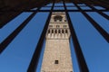 Backside of the Arnolfo Tower. View from a narrow window with iron grid of Palazzo Vecchio, Florence, Tuscany, Italy. Royalty Free Stock Photo