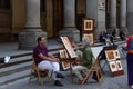 italy, florence 2018 - a painter makes a portrait in the streets of florence