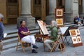 italy, florence 2018 - a painter makes a portrait in the streets of florence