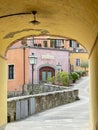 Colorful houses through a tunnel in Greve in Chianti, Italy