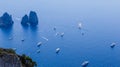 Italy. Island Capri. Faraglioni rocks and boats from Monte Solar