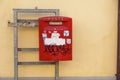 ITALY - January 32, 2017: View of a traditional Mail red pillar box outside a Post Office. Founded in 1516 Royal Mail