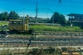 Italy - 28 June 2018: The yellow Plasser and Theurer on Trenitalia in the italian outskirts track