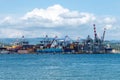 Italy, La Spezia, Industrial port with unloading cranes and containers