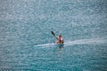 Italy Lake Lago di Ledro July 16, 2013. Female athlete engaged in kayak rowing