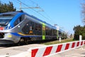 Italy Ã¢â¬â Level crossing barriers lowered with Trenitalia Jazz train in movement