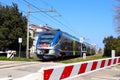 Italy Ã¢â¬â Level crossing barriers lowered with Trenitalia Jazz train in movement