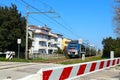 Italy Ã¢â¬â Level crossing barriers lowered with Trenitalia Jazz train in movement