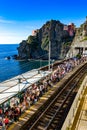 Italy. Liguria. Cinque Terre. Tourists waiting for the train connecting the Cinque Terre villages Royalty Free Stock Photo