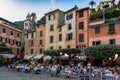 Italy. Liguria. Portofino. People at restaurant at the place of the village