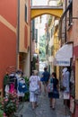 Italy. Liguria. Portofino. People walking in a alley of the Old Town