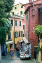 Italy. Liguria. Portofino. People walking in a alley of the Old Town
