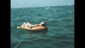 Italy 1966, Man relaxin sea inflatable