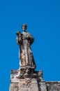 Italy. Matera. Church of San Francesco d`Assisi, 13th - 18th centuries. Detail of the baroque facade. Stone statue of St Francis Royalty Free Stock Photo