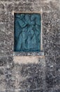 Italy. Matera. Via Crucis in the Sassi. 4th Station, Jesus meets Mary his mother. Bronze tile by Tito, as Ferdinando Amodei, 2004