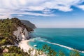 Italy May 2017 - view of Numana beach with crystal clear sea and limestone cliff Royalty Free Stock Photo