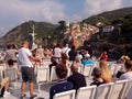 Tpurists enjoying scenery of Riomaggiore. Royalty Free Stock Photo