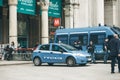 Italy, Milan, May 30, 2019: Police officers next to a police car on a city street on guard of law and order Royalty Free Stock Photo